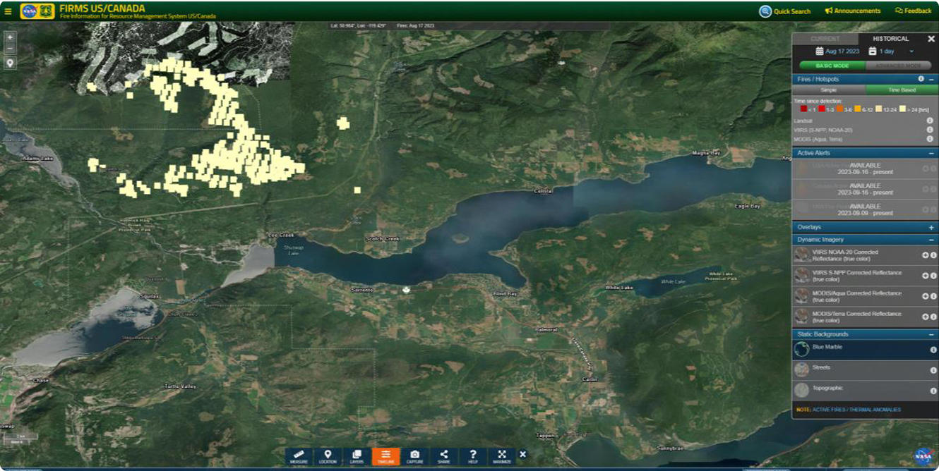 FIRMS wildfire hotspot map over forest and lake