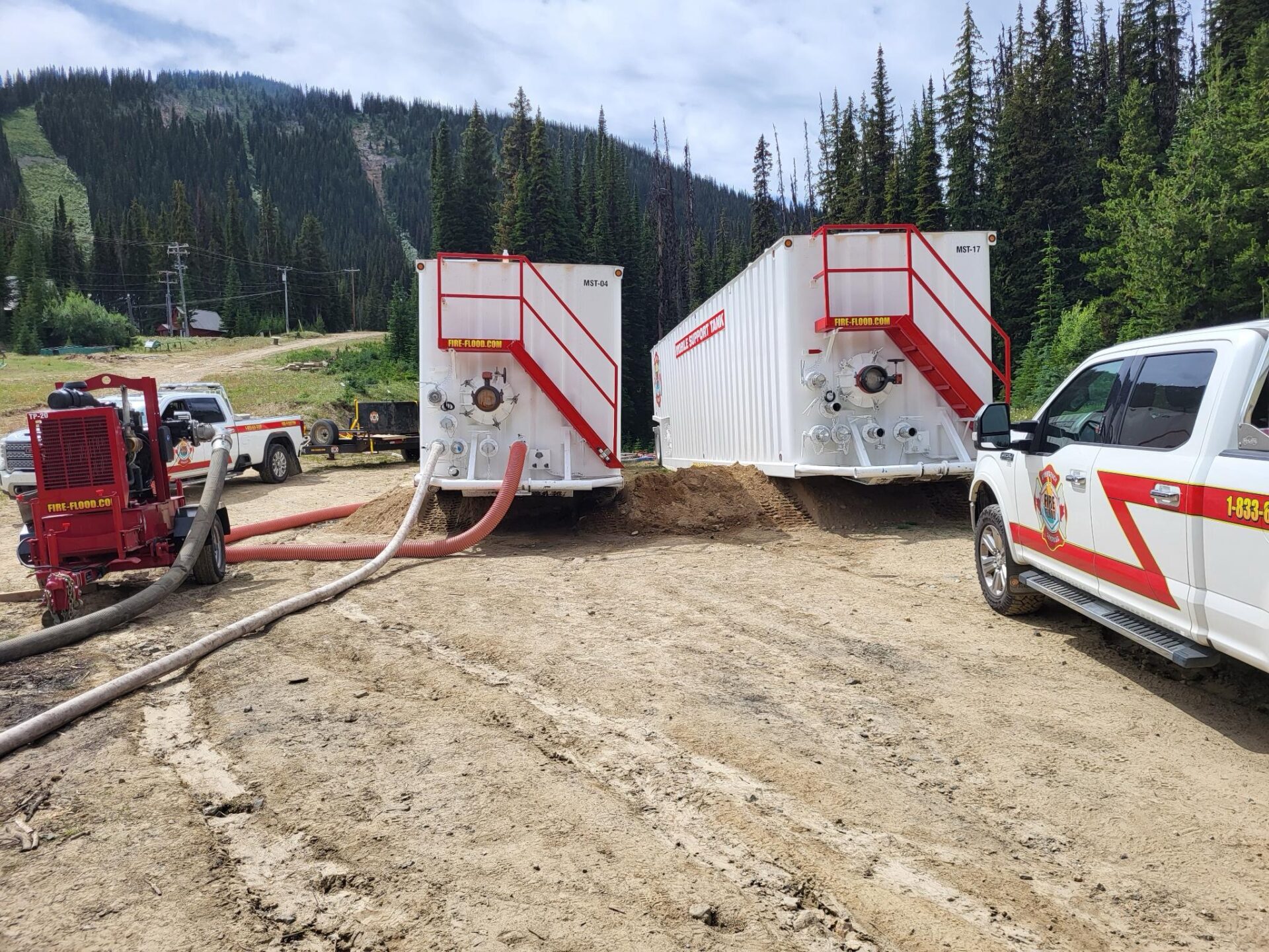 Fire support tanks and trucks in mountain forest