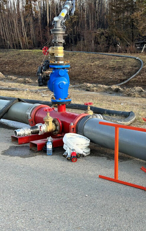 Industrial water pipeline with large valve and hoses